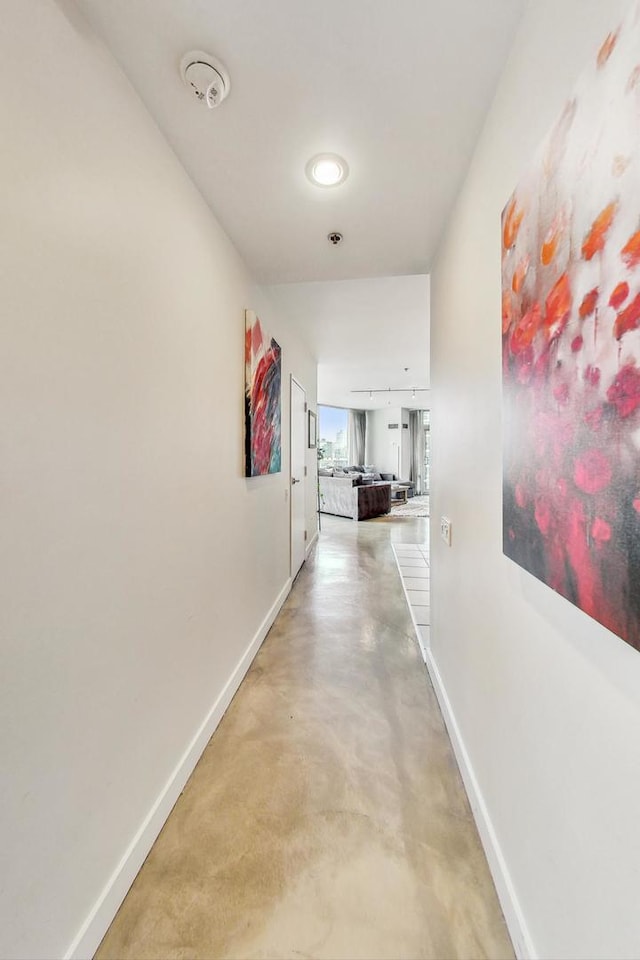 corridor with concrete flooring