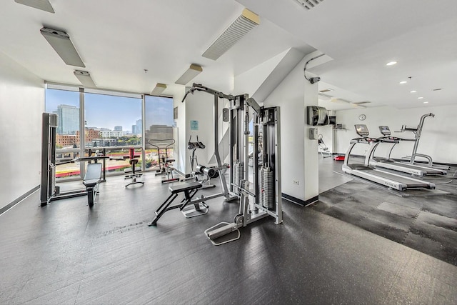 gym featuring floor to ceiling windows