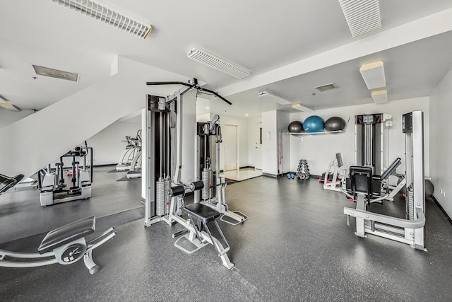 workout area with ceiling fan