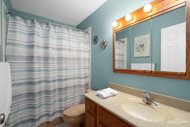 bathroom with toilet and vanity