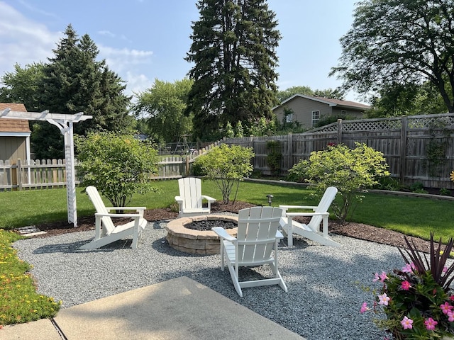 view of patio / terrace featuring an outdoor fire pit