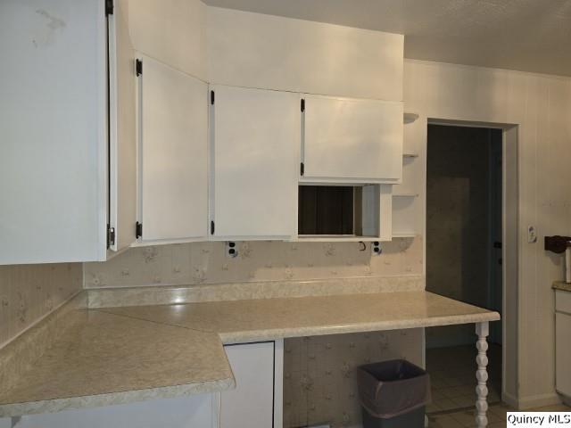 kitchen featuring white cabinetry