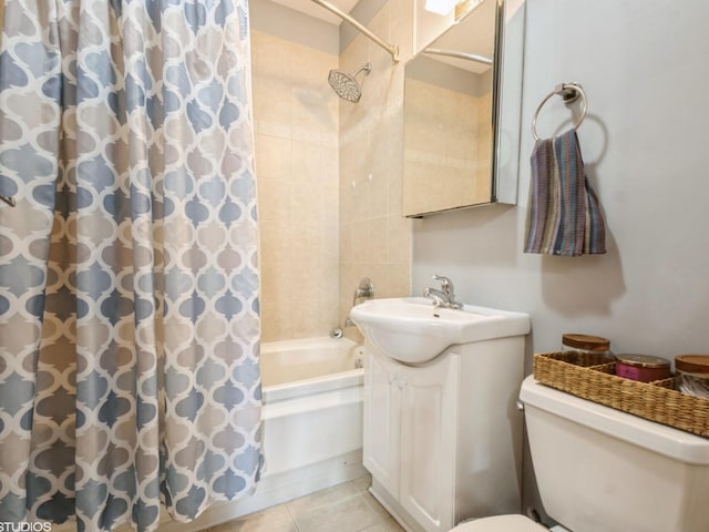 full bathroom featuring tile patterned flooring, vanity, toilet, and shower / bath combo with shower curtain