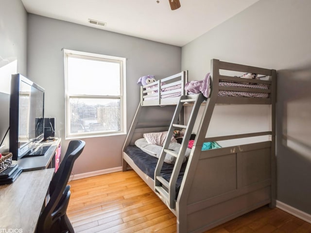 bedroom with wood-type flooring and ceiling fan