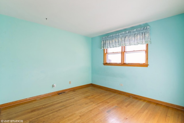 unfurnished room featuring light hardwood / wood-style floors