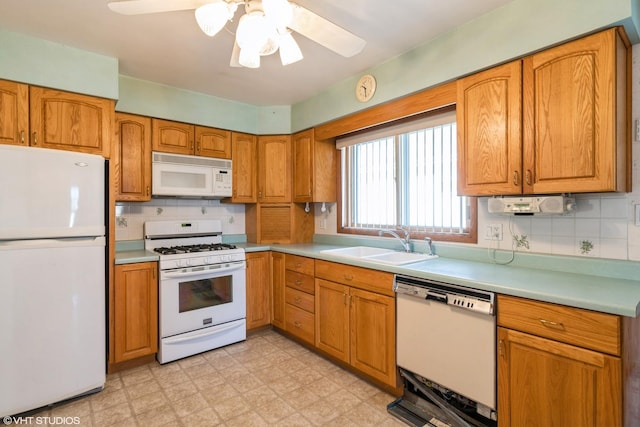 kitchen with ceiling fan, sink, white appliances, and decorative backsplash