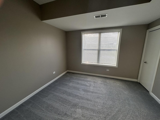 unfurnished room featuring carpet