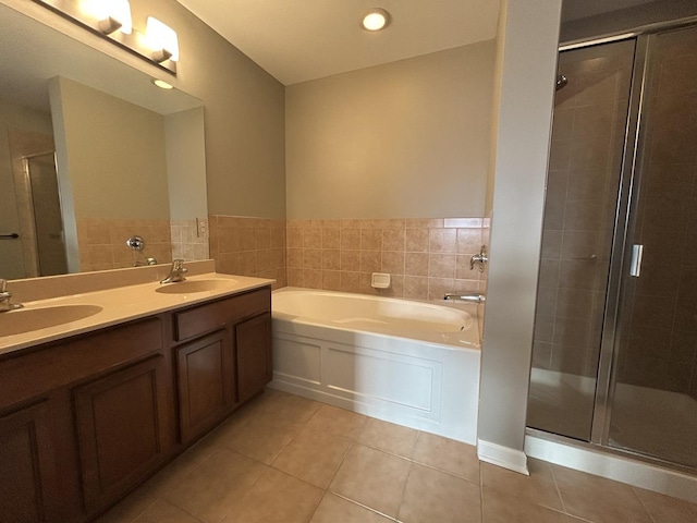 bathroom with vanity, independent shower and bath, and tile patterned flooring