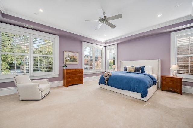 carpeted bedroom with ceiling fan and ornamental molding