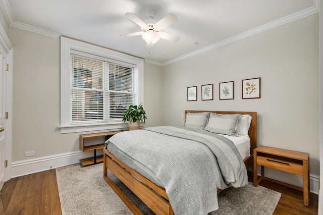 bedroom with ceiling fan, ornamental molding, and hardwood / wood-style flooring