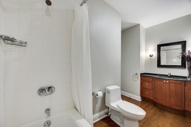 full bathroom with toilet, shower / bath combination with curtain, hardwood / wood-style flooring, and vanity