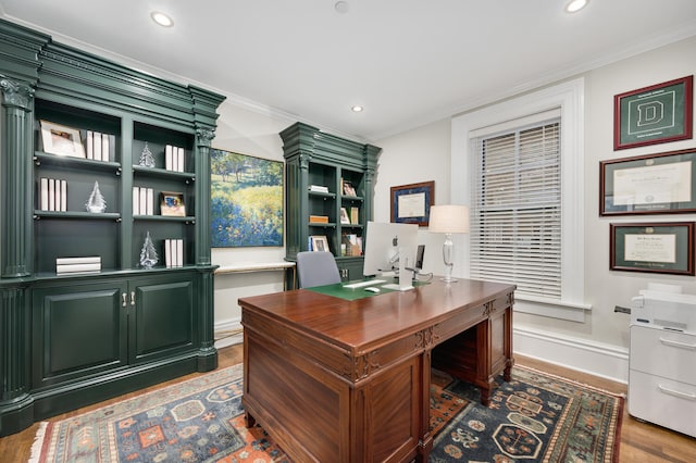 office area featuring dark hardwood / wood-style flooring and crown molding