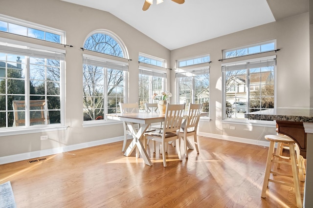 sunroom featuring lofted ceiling and ceiling fan