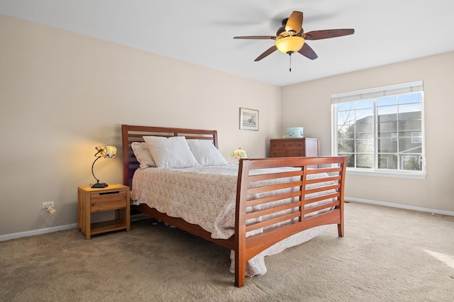 bedroom featuring ceiling fan and carpet