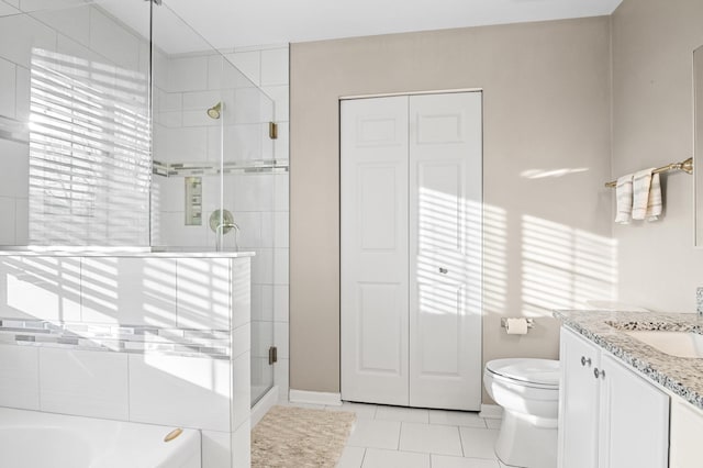 full bathroom featuring tile patterned flooring, plus walk in shower, vanity, and toilet