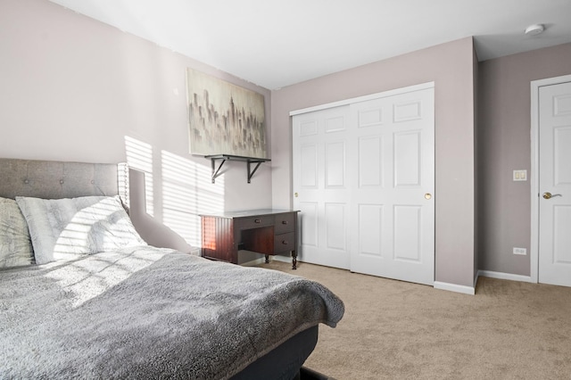 bedroom with light carpet and a closet