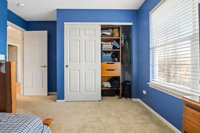 carpeted bedroom featuring a closet