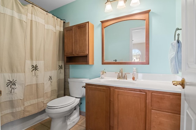 bathroom with vanity, curtained shower, tile patterned floors, and toilet