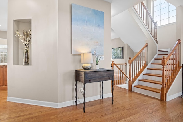 staircase featuring wood-type flooring