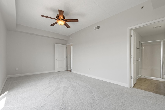 unfurnished room with ceiling fan and light colored carpet