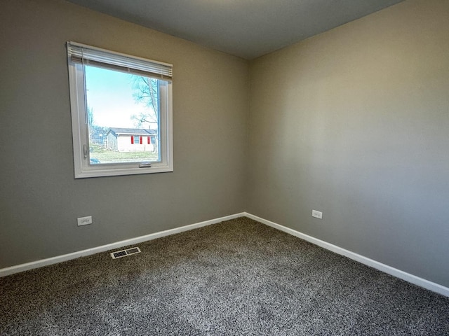 unfurnished room with carpet floors