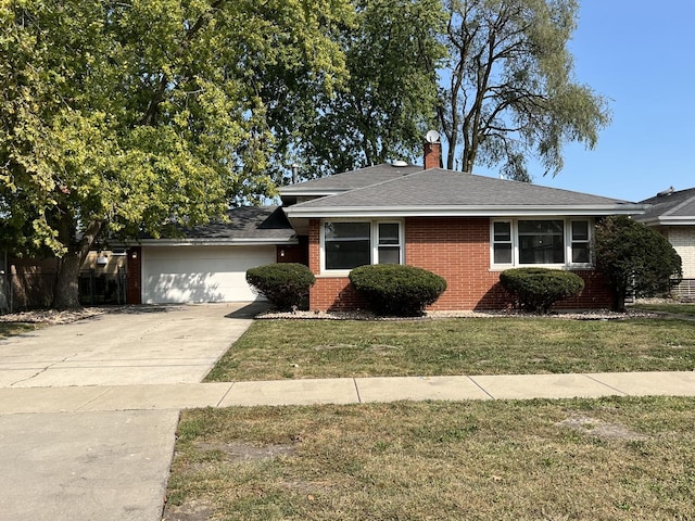 view of front facade with a front lawn and a garage