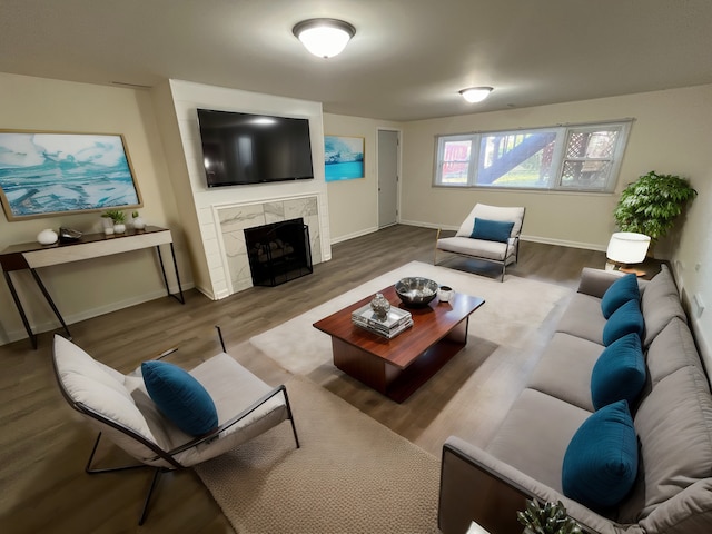 living room featuring wood-type flooring and a fireplace