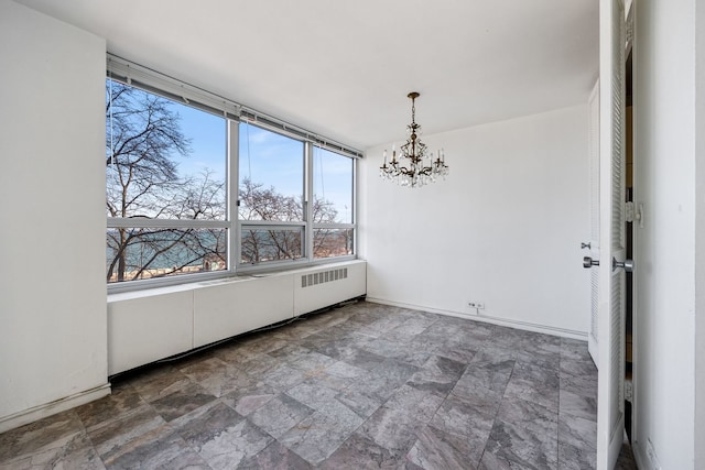 unfurnished dining area with radiator heating unit and an inviting chandelier