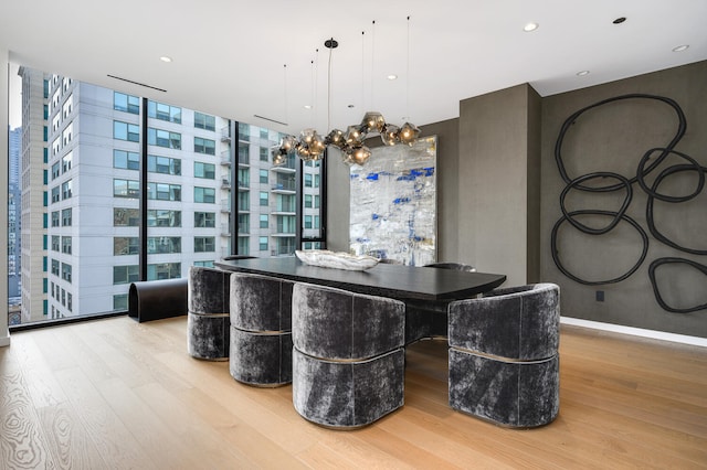 dining room with expansive windows and wood-type flooring