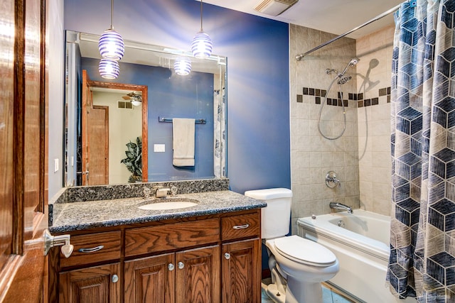 full bathroom featuring vanity, shower / bath combination with curtain, and toilet