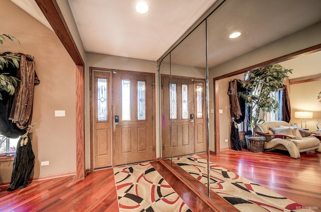 foyer entrance with hardwood / wood-style floors