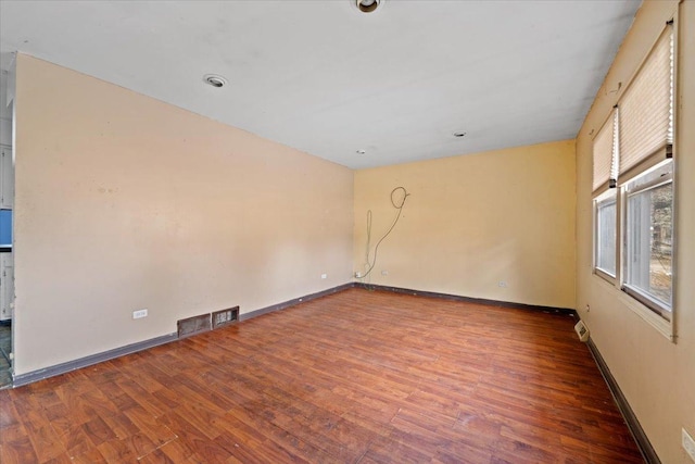 unfurnished room featuring wood-type flooring