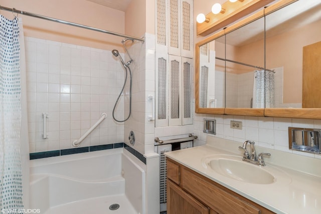 bathroom featuring tasteful backsplash and vanity