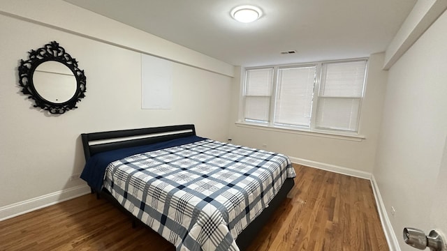 bedroom featuring dark wood-type flooring