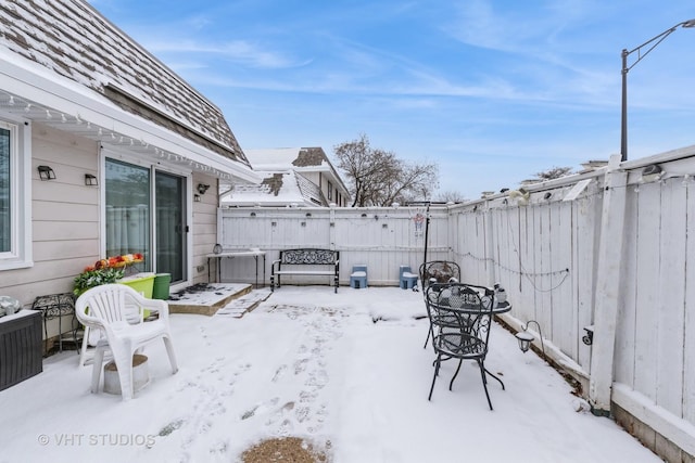 view of snow covered patio