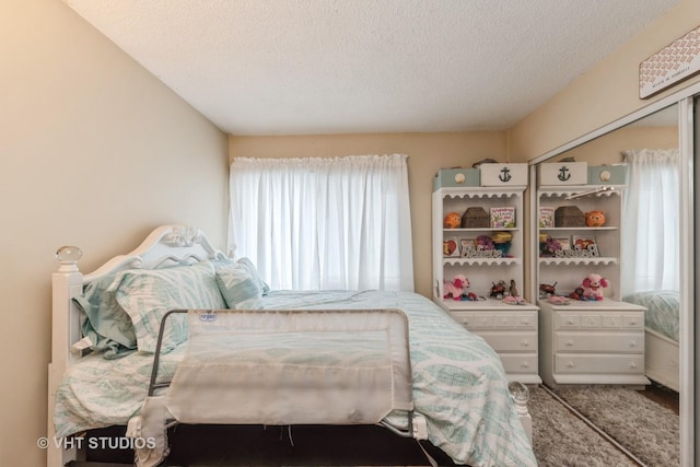 bedroom featuring a textured ceiling