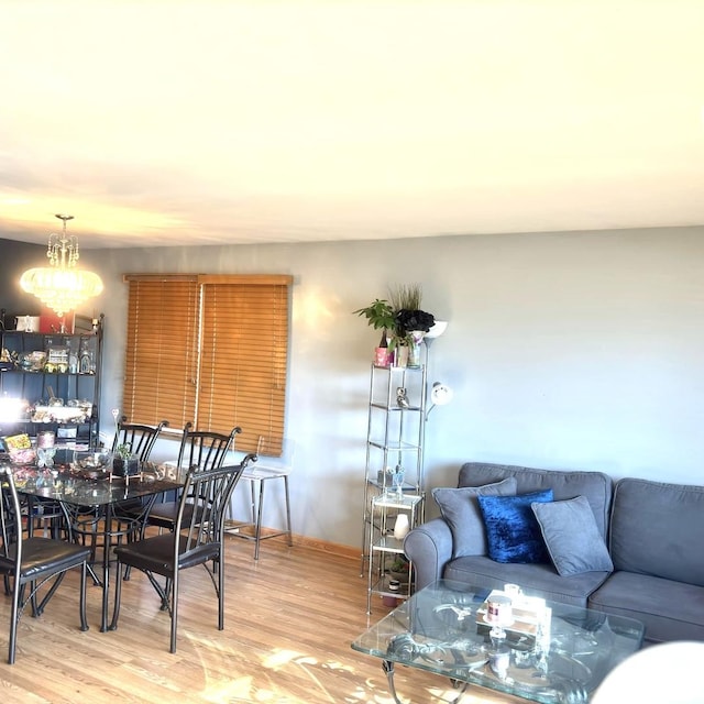 living room with a chandelier and hardwood / wood-style floors