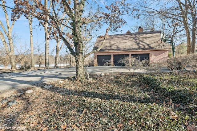 view of yard with a garage