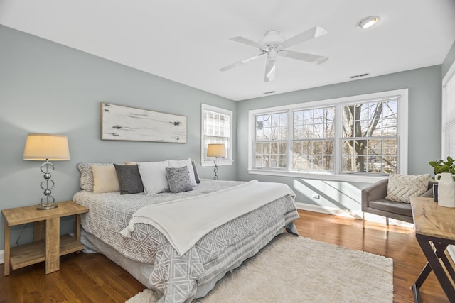 bedroom with ceiling fan and hardwood / wood-style floors