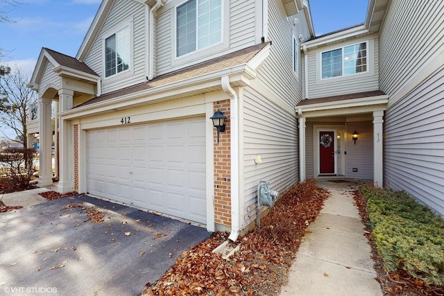 entrance to property featuring a garage