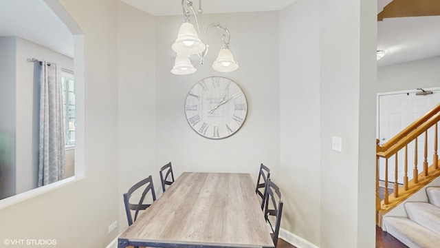 dining space with a chandelier