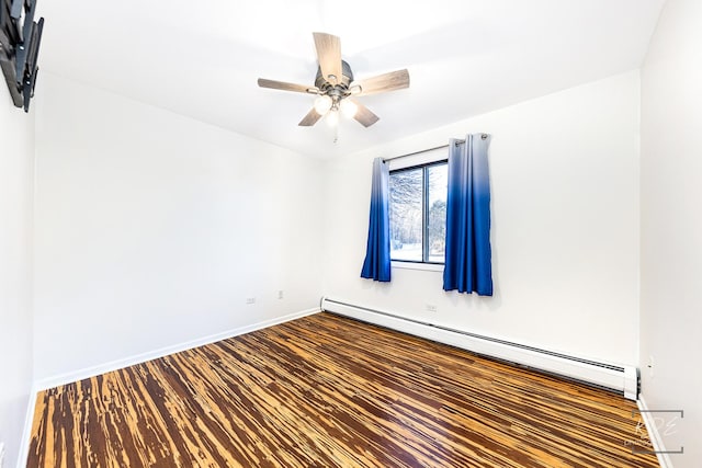 unfurnished room featuring hardwood / wood-style flooring, a baseboard heating unit, and ceiling fan