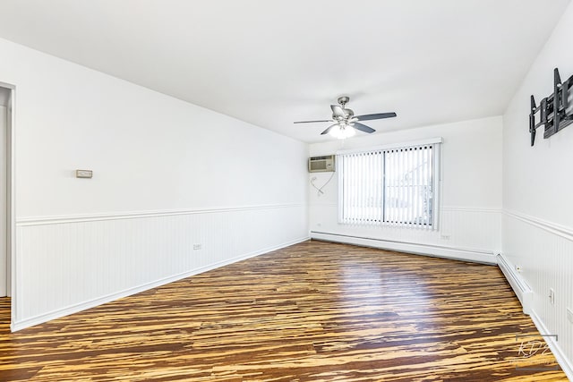 unfurnished room with ceiling fan, an AC wall unit, baseboard heating, and dark hardwood / wood-style flooring