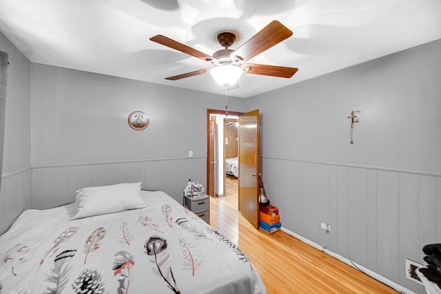 bedroom featuring ceiling fan and hardwood / wood-style floors