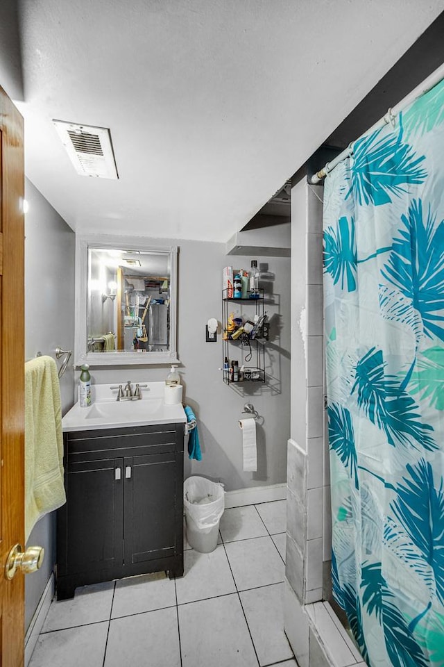 bathroom with a shower with shower curtain, tile patterned flooring, and vanity