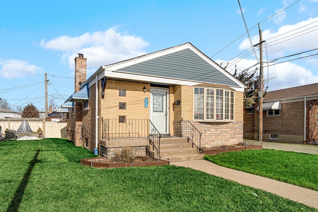 bungalow-style home with a front yard