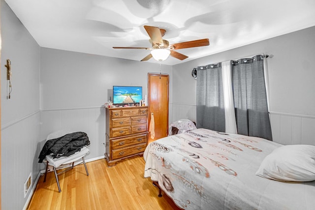 bedroom featuring ceiling fan and light hardwood / wood-style floors