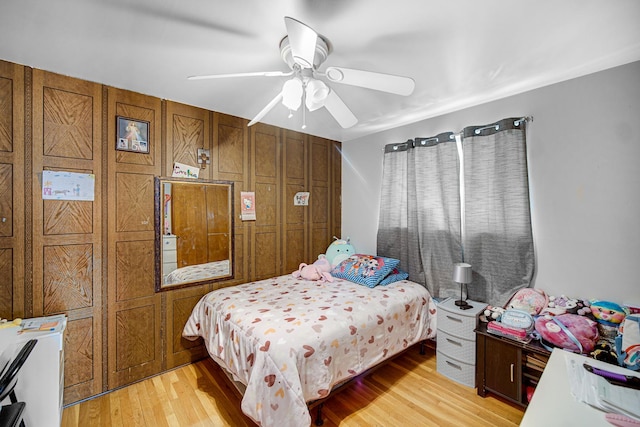 bedroom with light wood-type flooring and ceiling fan