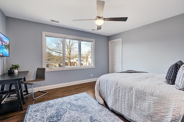 bedroom featuring ceiling fan and dark hardwood / wood-style floors