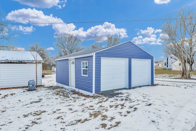 view of snow covered garage